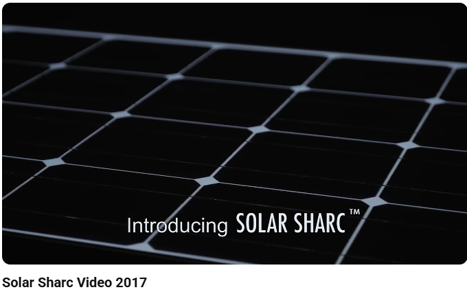 Image of black 7 white Solar Sharc Panels & wording "Introducing Solar Sharc TM" from the 'Solar Sharc' WM Cline Commercial Voiceover Video