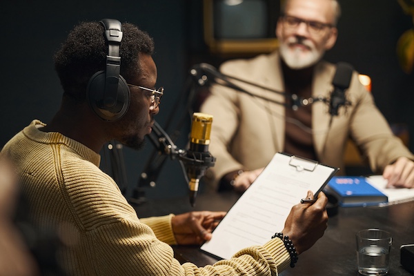 African American man reading plan before podcast