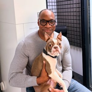 William Marshall Cline in his home recording studio with his boston terrier Grayson