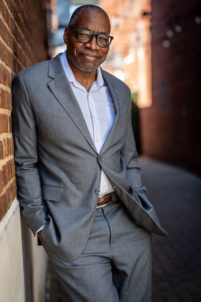 Voice Actor William M Cline in grey suit during photoshoot